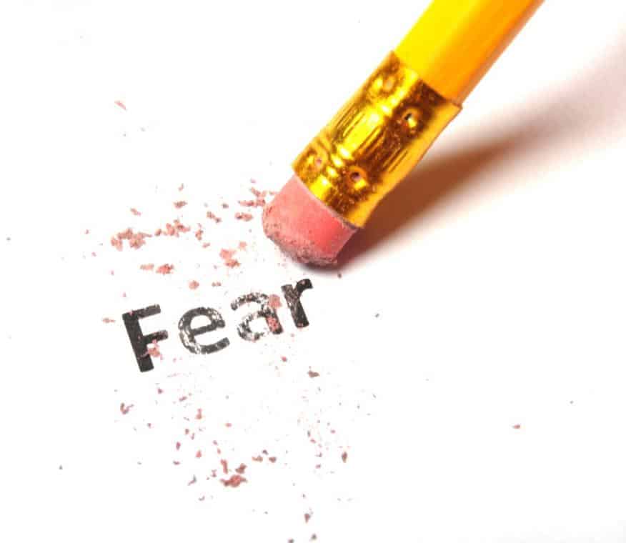 image of the word fear being erased with a pencil