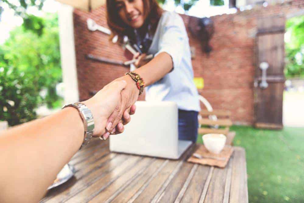 two people shaking hands in recovery