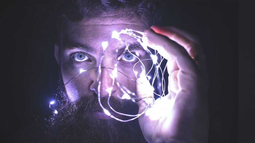man holding lights neurons and THIQ