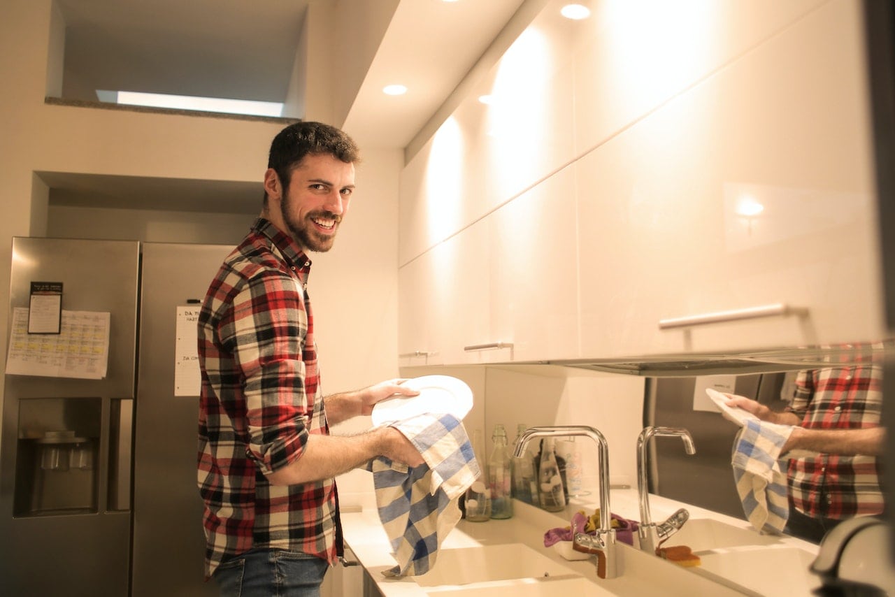 man in sober living learning responsibility with chores