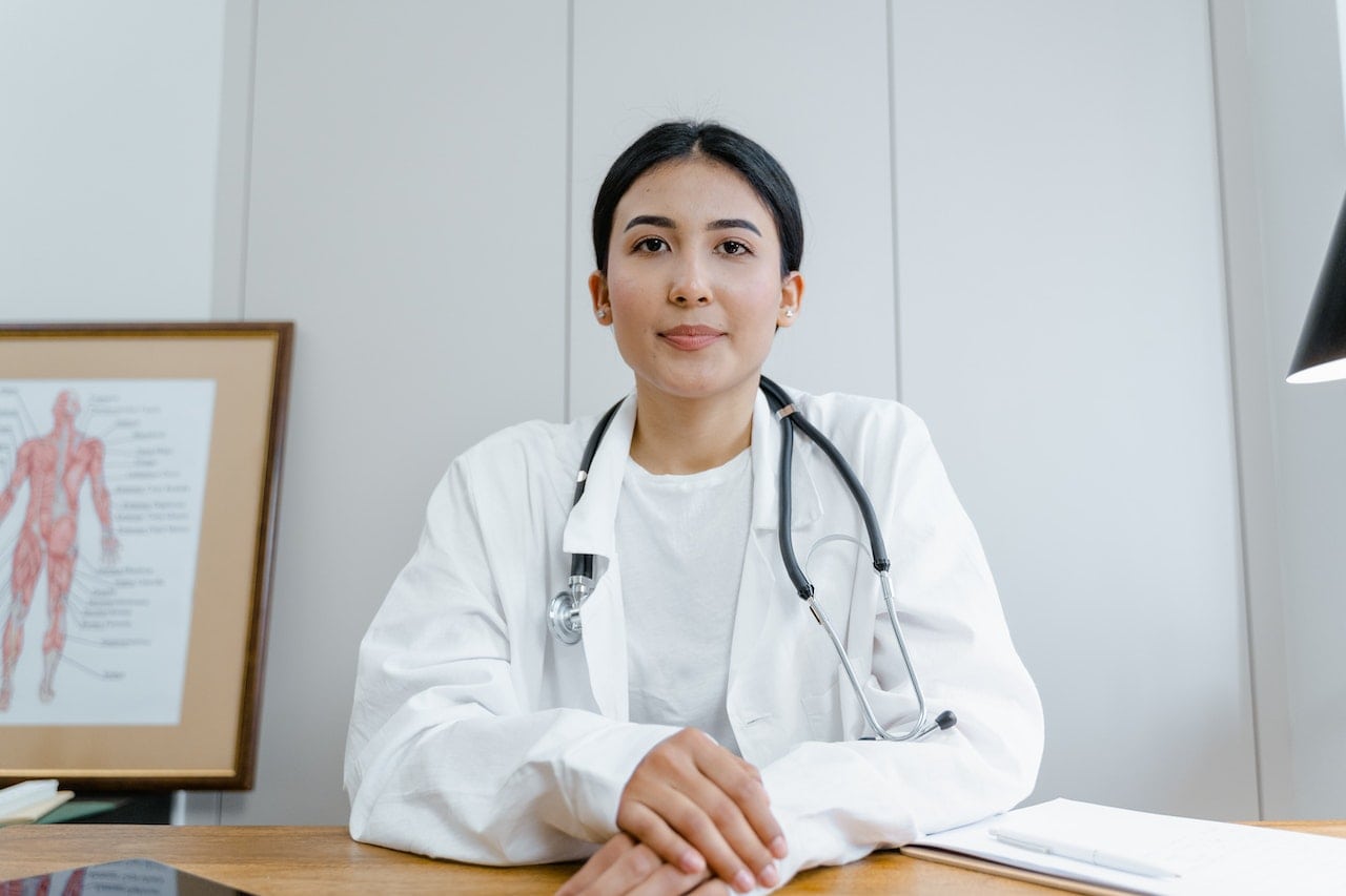 woman dressed as doctor talking facts on MAT